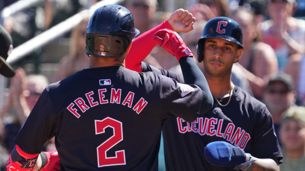 Mar 2, 2024; Goodyear, Arizona, USA; Cleveland Guardians third baseman Tyler Freeman (2) celebrates with Cleveland Guardians shortstop Brayan Rocchio (4) after hitting a home run against the Kansas City Royals during the first inning at Goodyear Ballpark. Mandatory Credit: Joe Camporeale-USA TODAY Sports